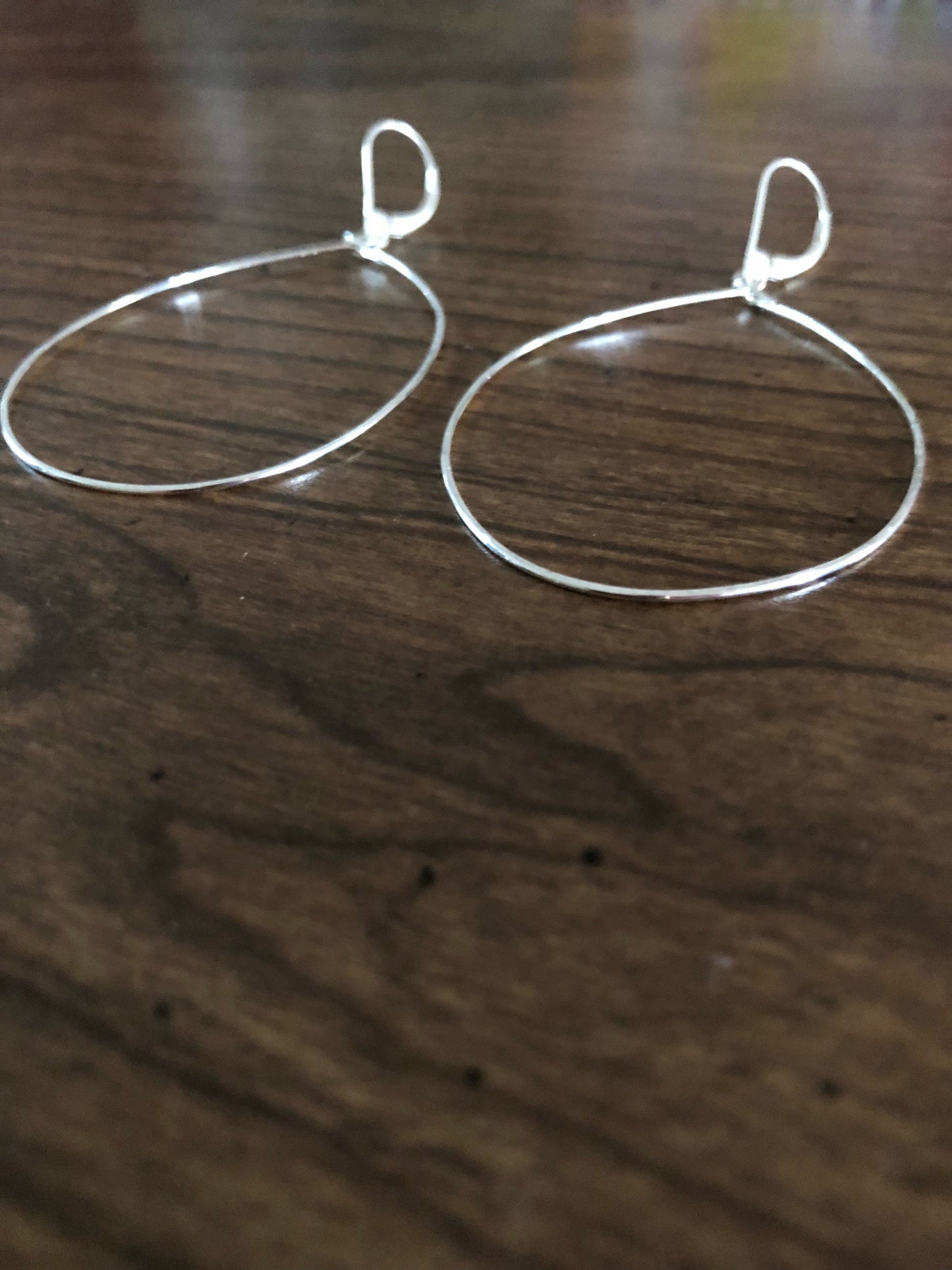 Large dangle tear drop hammered hoops
