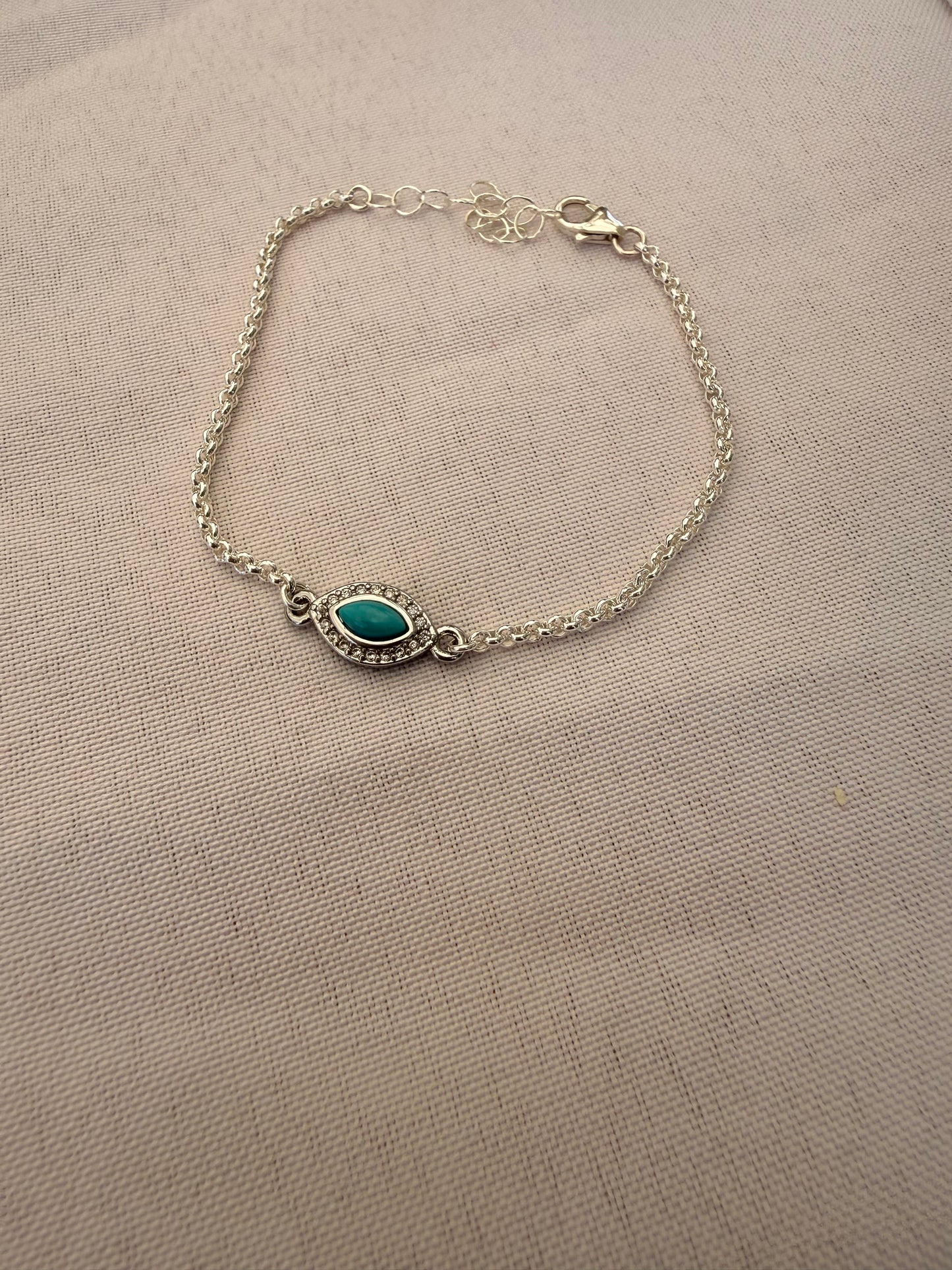 Sterling silver rolo link chain link bracelet with evil eye or clover connector