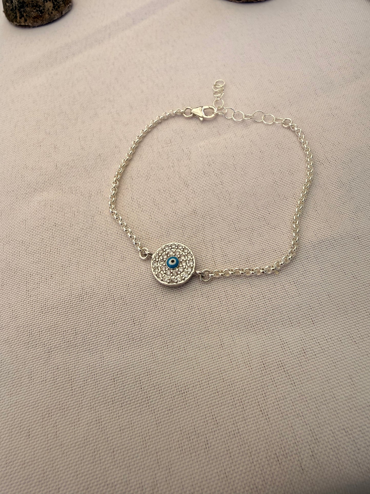 Sterling silver rolo link chain link bracelet with evil eye or clover connector