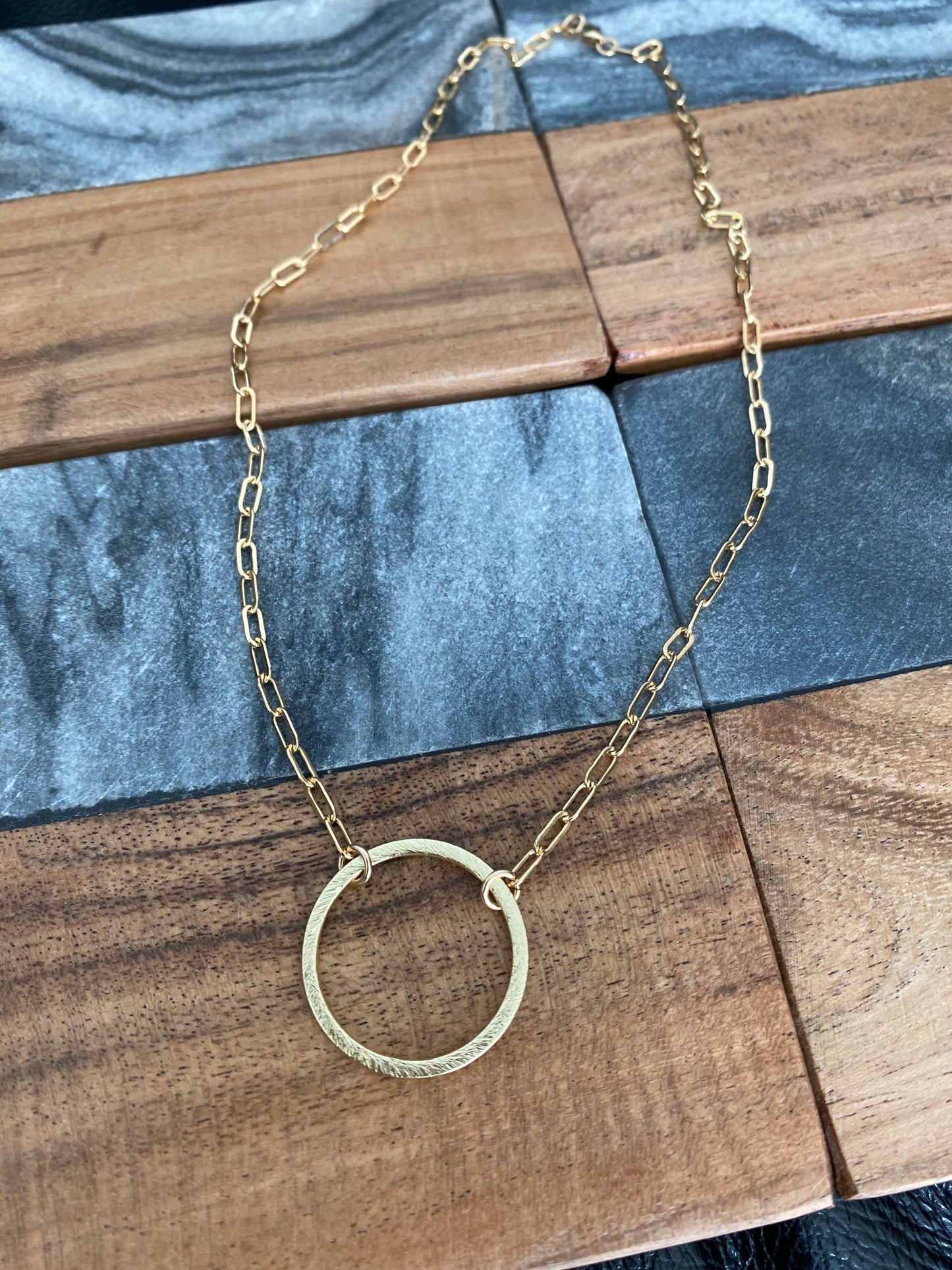 Circle pendant with small paper clip chain necklace