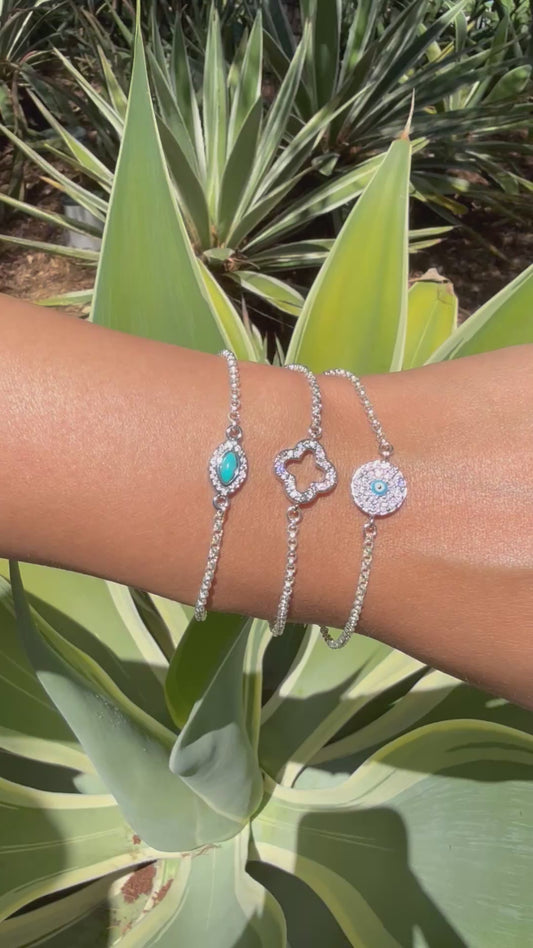 Sterling silver rolo link chain link bracelet with evil eye or clover connector